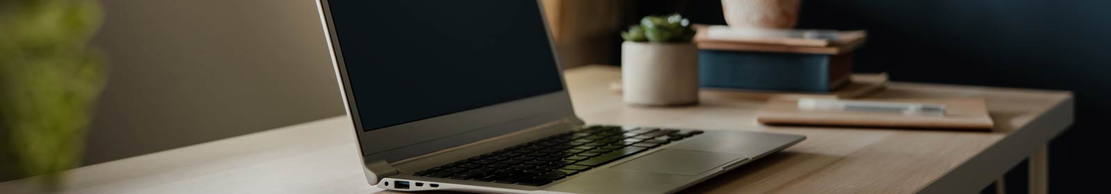 a laptop on a desk table