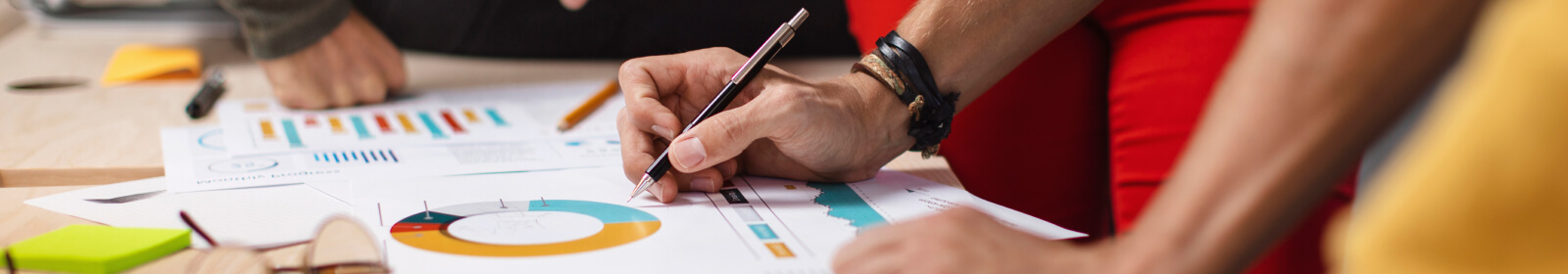 a group of people reviewing financial documents